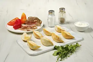 Frozen Dumplings Prints: Frozen dumplings with bacon and mashed potato