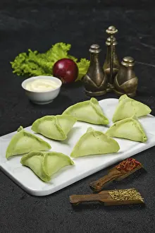 Traditional Italian Cooking Methods Prints: Frozen dumplings with spinach