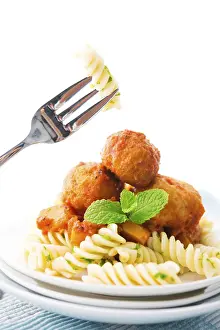 Dairy Product Photography Prints: Fusilli on fork, meatball fusilli as background