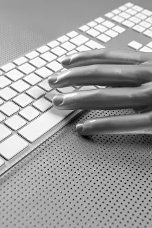 Uninhabited Workspace Image Prints: Futuristic silver gray hand and computer keyboard