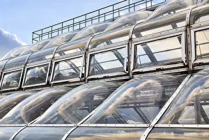 Deserted Cityscape Photography Prints: Futuristic window facade with reflecting sky