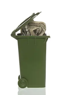Financial Crisis Prints: Garbage container with dollar bills