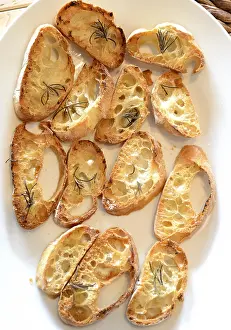 Gastronomy Meal Ideas Prints: Garlic bread with herbs, on white bread dish