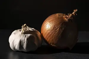 Dark Background Food Images Prints: Garlic and an onion side by side