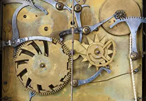 Clockwork Mechanism Prints: Gears and cogs in the clockwork of a historical pendulum clock