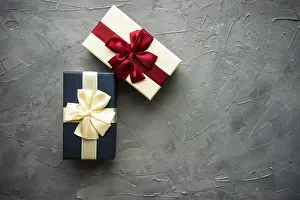 Symbolic Picture Of A Present Prints: Gift box concept on rustic background with copy space