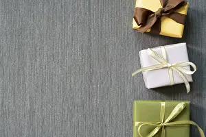 Gift Presentation Ideas Prints: Gift boxes on gray fabric background
