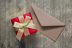 Stationary Office Supplies Prints: Gift or present box and envelope on the table