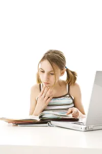 Young Girl Learning Prints: Girl learning with a computer