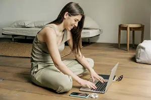 Female Student Studying Prints: Girl student studying using a computer