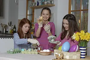 Southern Germany Culture Prints: Girls colouring Easter eggs for Easter
