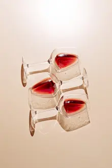 Bar Atmosphere Prints: Three glasses of red wine placed on a flat surface