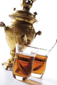 Studio Background For Food Photography Prints: Two glasses of tea in front of a samovar