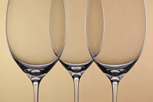 Empty Wine Glasses Prints: Three empty glasses of wine on a background