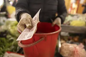 Colorful Street Scene Prints: A gloved hand exchanges a banknote over a red container
