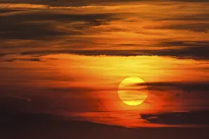 Deserted Sunset Prints: Glowing sun, sunset with clouds