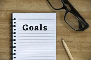 Empty Notepad Prints: Goals text on notepad with glasses
