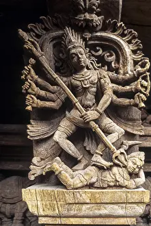 Hindu Temple Sculpture Prints: God killing demon with trident