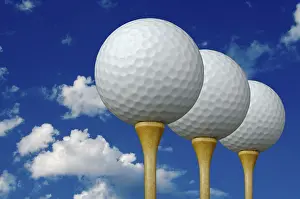Deserted Golf Course Prints: Three golf balls & tees on the left with clouds