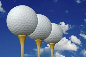 Cloudy Sky Backgrounds Prints: Three golf balls & tees on the left with clouds