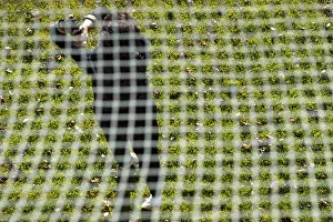 Recreational Golf Activity Prints: Golfer Training on Driving Range Behind a Net