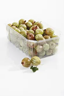 Vitamin Rich Berries Prints: Gooseberries in a small plastic container