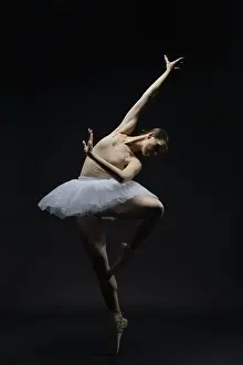 Ballet Dancer Pose Prints: A graceful ballet dancer performs an expressive pose under soft lighting