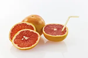 Red Citrus Fruit Prints: Grapefruit with a straw as a drink
