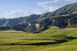 Uninhabited Sandstone Rock Formations Prints: Grassland with sandstone cliffs and cliffs