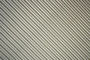 South American Architecture Prints: A gray security shutter over the front of a building in Cotacachi