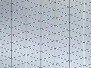 Minimalist Architectural Style Prints: A gray surface featuring a modern geometric pattern composed of interconnected triangles