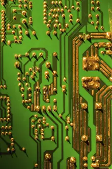 Green Circuit Board Prints: Green and gold computer circuit board close-up