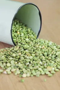 Still Life Studio Shots Prints: Green split peas, spilled from a container