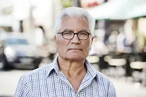 German Street Scene Prints: Grey-haired Senior with migration background