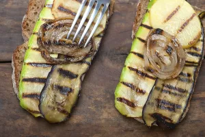 Gastronomy Photography Prints: Grilled vegetables on rustic bread over wood table