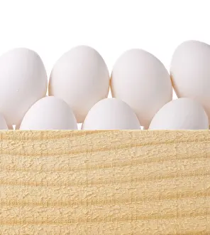 Prints of Group of fresh eggs in wooden package Chickens Prints: Fresh Eggs in Wooden Package Print