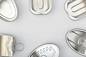 Gray Background Copy Space Prints: Group of empty tin can isolated on a gray background