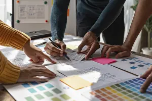 Ux Design Brainstorming Prints: Group of ux developer and ui designer brainstorming about app interface design at modern office