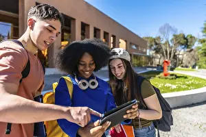 University Campus Collaboration Prints: Group of young students from different ethnical backgrounds collaborating