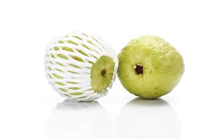 Fruity Still Life Photography Prints: Two guavas, one packed in plastic