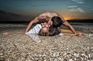 Coastal Landscape Photo Prints: Guy and his girlfriend are on the beach