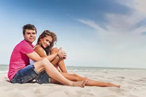 Coastal Scenery Prints: Guy and his girlfriend are on the beach