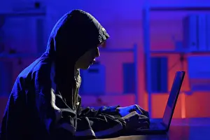 Cybersecurity Threats Prints: Hacker executing cyberattack leading to data breach