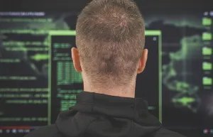 Digital Identity Theft Prints: Hacker. Rear view. Hacking and internet security concept