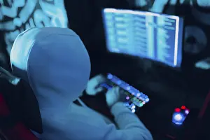 Cybercrime Prevention Prints: Hacker using computer malware virus software and hacking binary code green digital interface