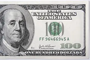 Studio Shot Of Currency Prints: Half of a one hundred dollar bill close-up