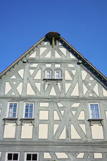 Blue Sky Cityscape Prints: Detail of a half-timbered house with windows