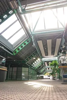 Deserted German Building Prints: Empty hall with modern roofing