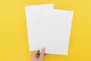 Deserted Office Scene Prints: Hand with two brochures