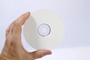 Data Storage Device Prints: Hand holding a CD